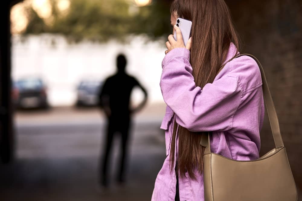 Photo of a Man Stalking a Woman